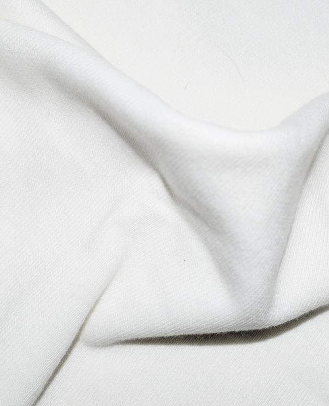 RAVVIX Oversized White “Wave” Tee – Minimal Streetwear with a Bold Artistic Touch